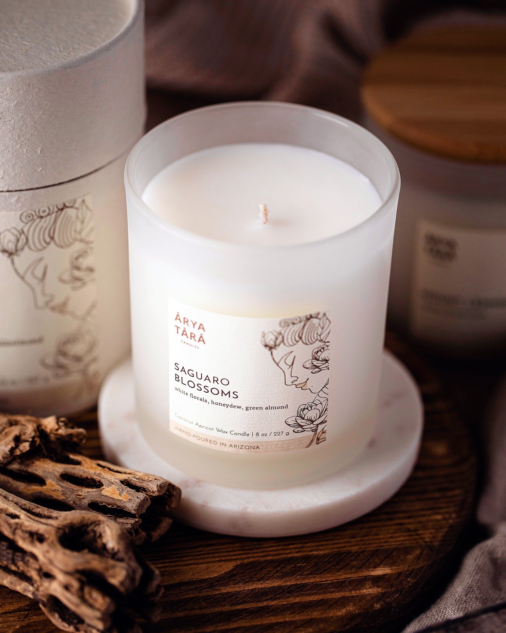 Saguaro Blossoms Candle by Arya Tara Candles. Cactus flower scented candle. Jasmine, magnolia, lily of the valley, honeydew melon, green almond, vanilla. Luxury candle, natural candle. Made in Tucson Arizona, hand poured candle in small batch. Non-toxic natural candle made with coconut apricot wax, lead-free zinc-free wicks, premium fragrances.